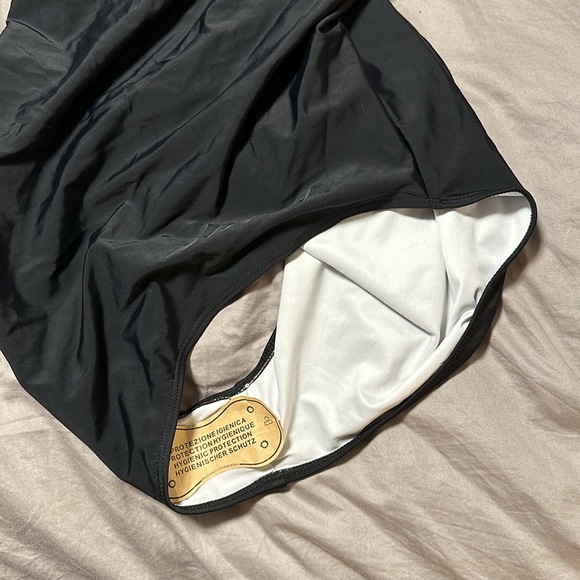 Never worn awesome swimsuit. It didn’t fit me, I have the size that did. 😊 - Picture 4 of 6